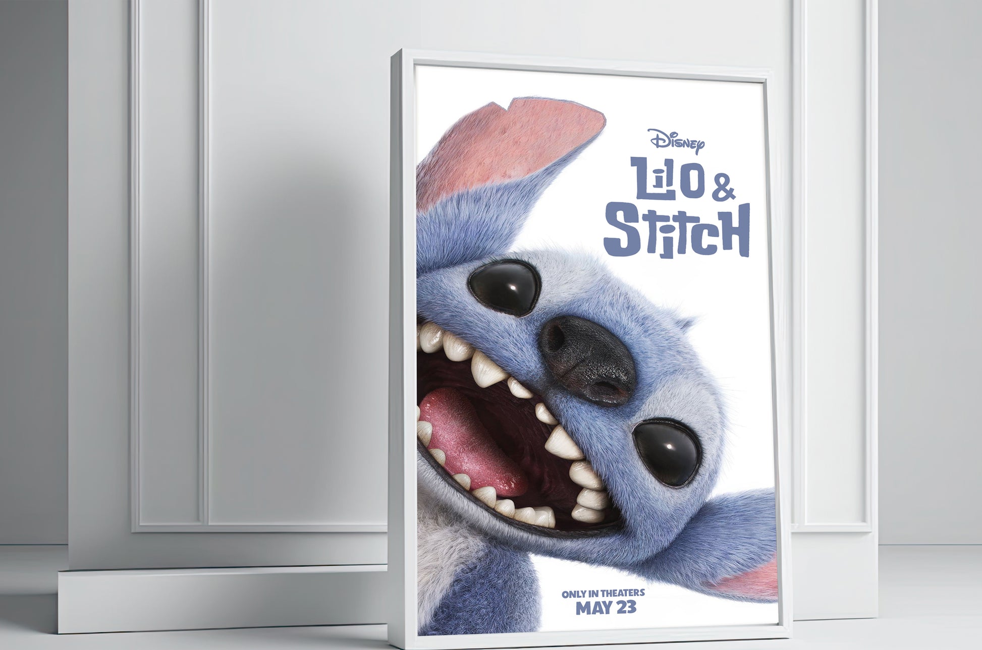 Framed poster of a cartoon character with 'Lilo & Stitch' branding on a white wall.