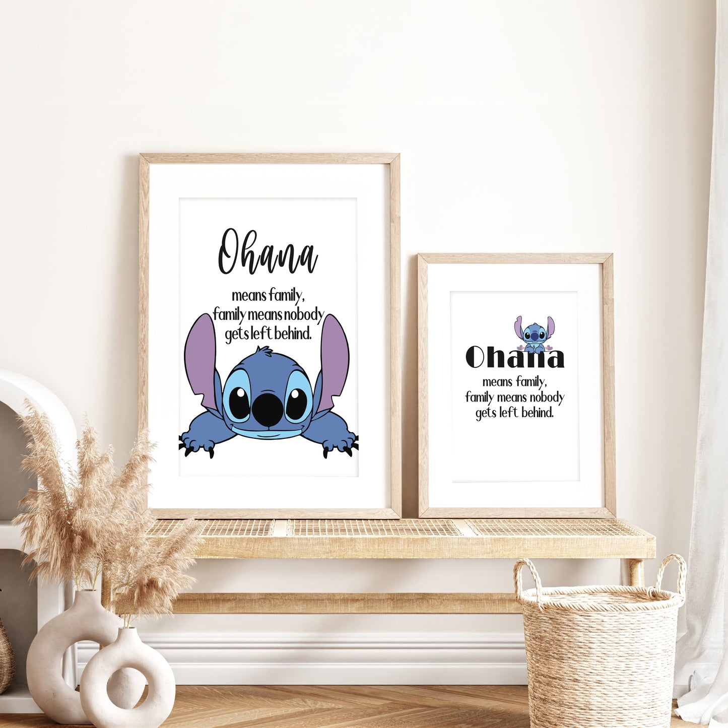 Framed 'Ohana' prints with a cartoon character on a wooden shelf. lilo and stitch wall posters