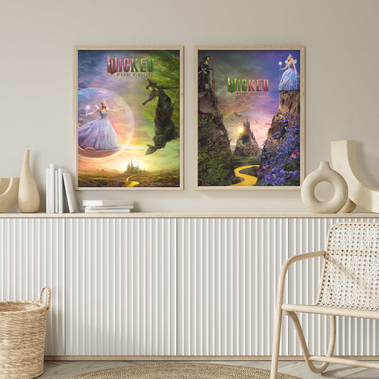 Two 'Wicked' movie posters on a wall above a white console table with decorative items.